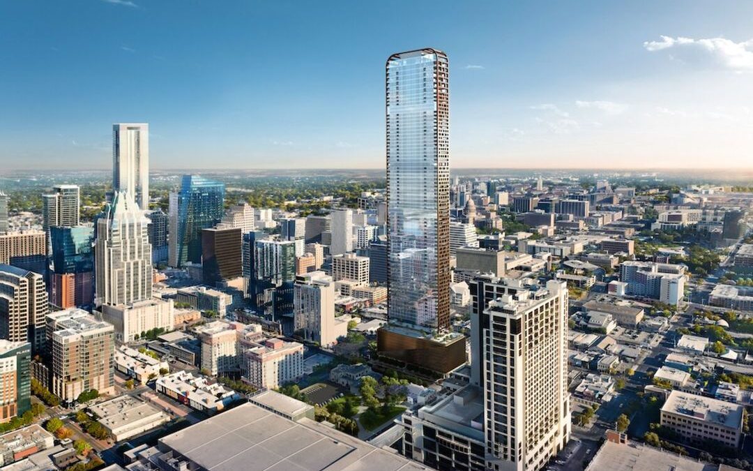 Aerial view of a modern skyscraper in a city.