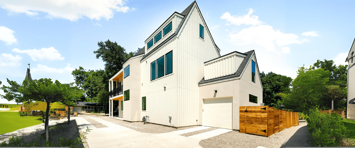 A house with a wooden fence and a wooden fence.