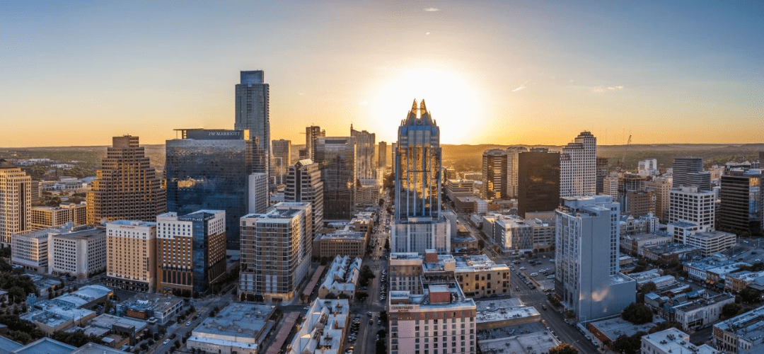 Austin skyline at sunset with skyscrapers.